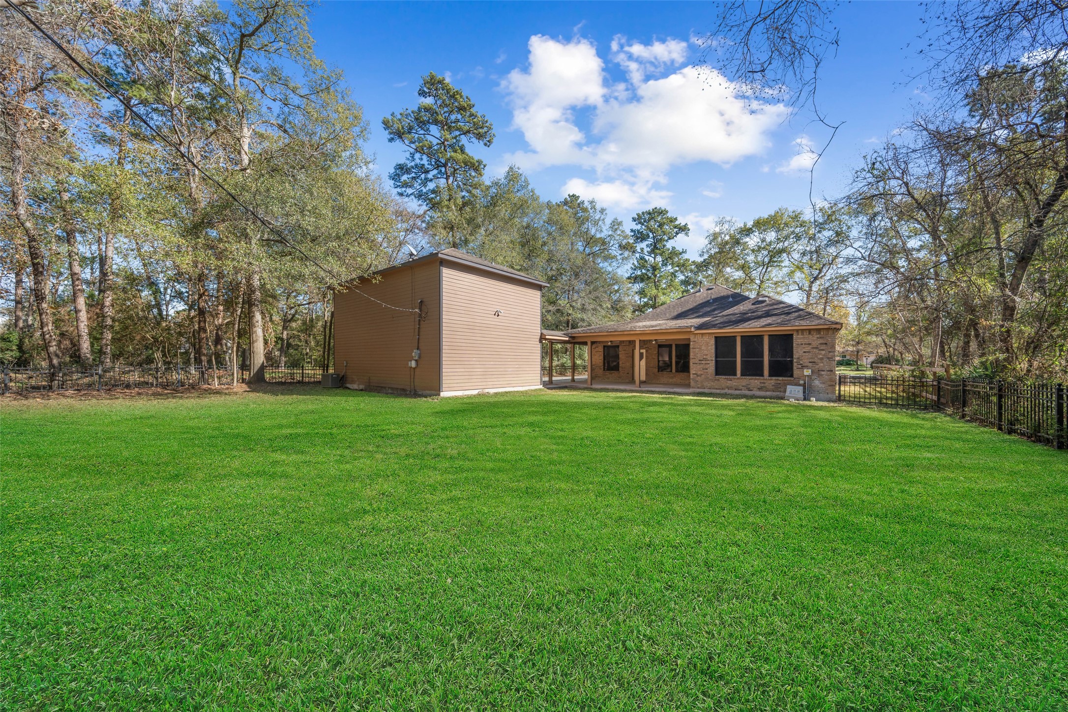 29627 Spring Forest Drive Spring, TX 77386 - Photo 24 of 29 View of home from the back of the yard. 3 car garage has apartment with kitchenette and full bath.