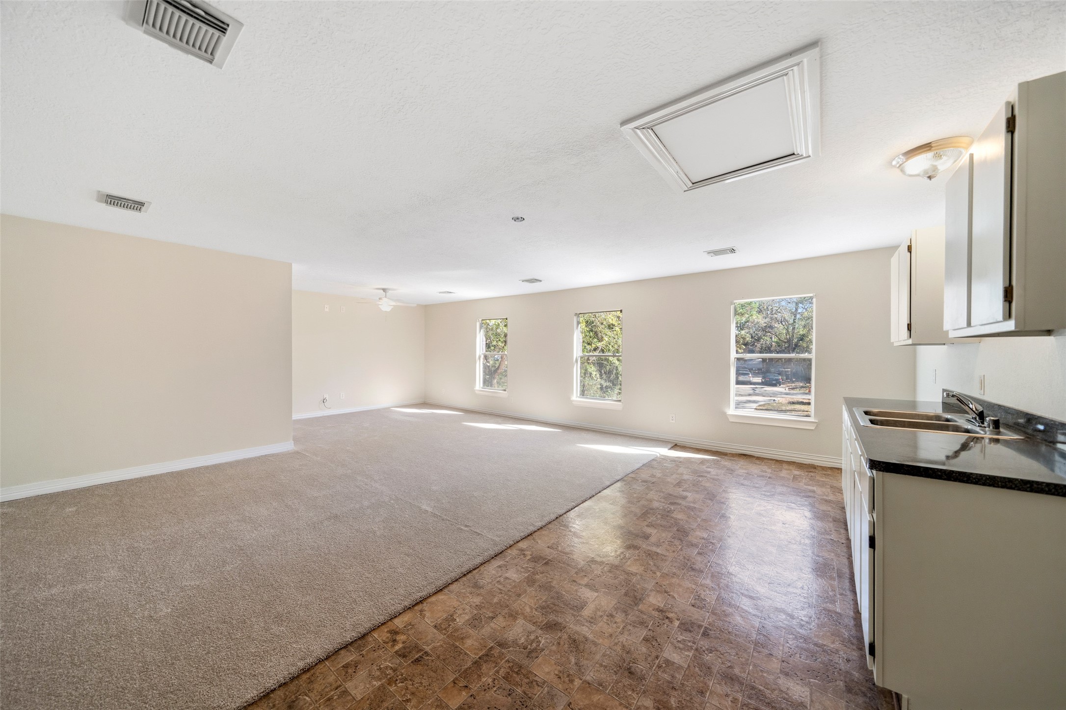 29627 Spring Forest Drive Spring, TX 77386 - Photo 26 of 29 Freshly painted cabinets, new ceiling fan and carpet.