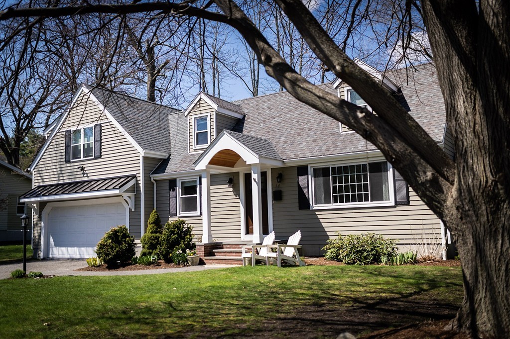 13 Pinewood Road Wellesley, MA 02482 - Photo 1 of 16 a front view of a house with a yard