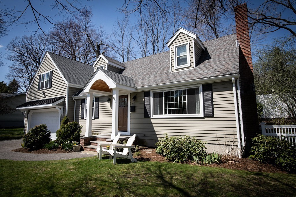 13 Pinewood Road Wellesley, MA 02482 - Photo 2 of 16 a front view of a house with garden