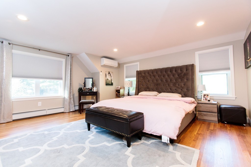 13 Pinewood Road Wellesley, MA 02482 - Photo 9 of 16 a spacious bedroom with a bed and wooden floor
