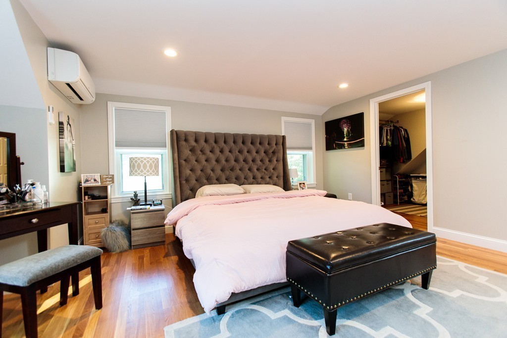 13 Pinewood Road Wellesley, MA 02482 - Photo 10 of 16 a bedroom with a bed and wooden floor