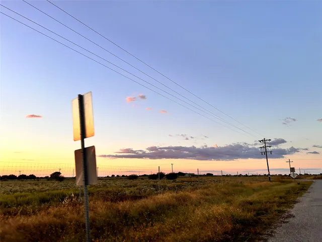 a view of a ocean with a mountain in the background
