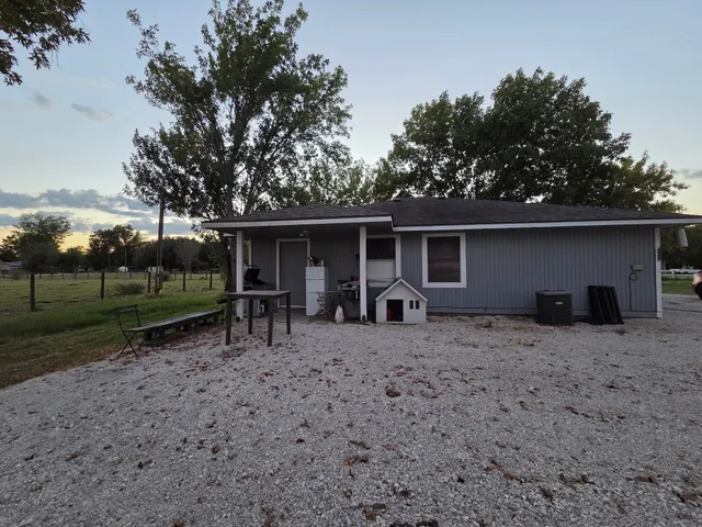 a view of house with backyard space