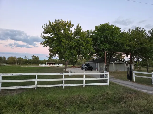 a view of a bench in front of a house