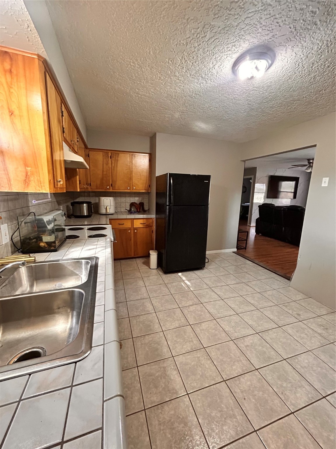 8118 Hamilton Road Brookshire, TX 77423 - Photo 6 of 22 a kitchen with stainless steel appliances granite countertop a stove a sink and a microwave