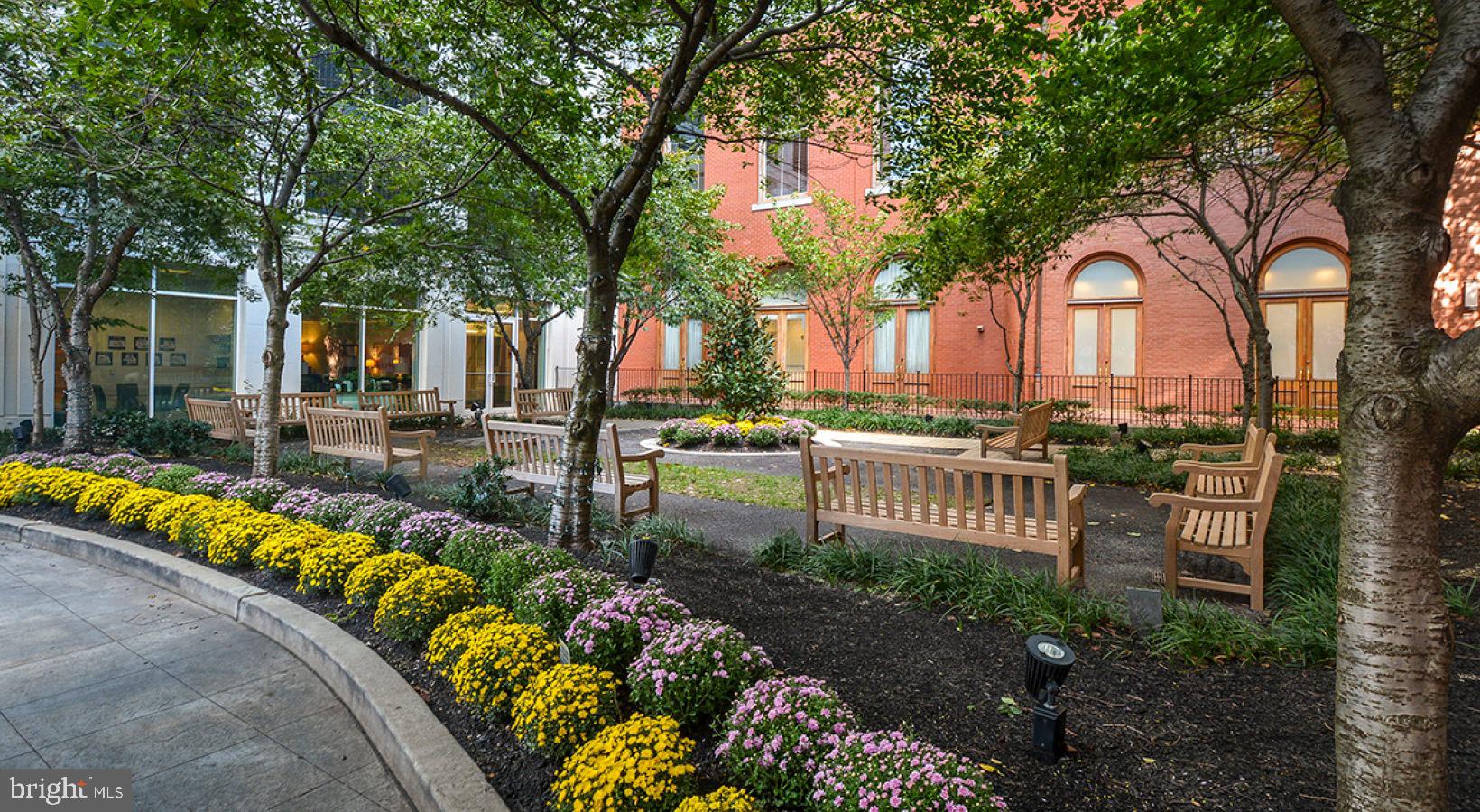 205 West Washington Square, Unit 2203 Philadelphia, PA 19106 - Photo 14 of 18 front view of a house with a garden