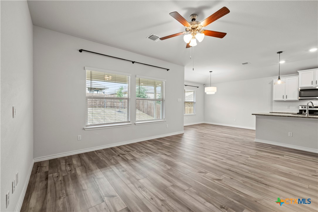 6243 Matagorda Road Belton, TX 76513 - Photo 11 of 27 a view of an empty room with window and wooden floor