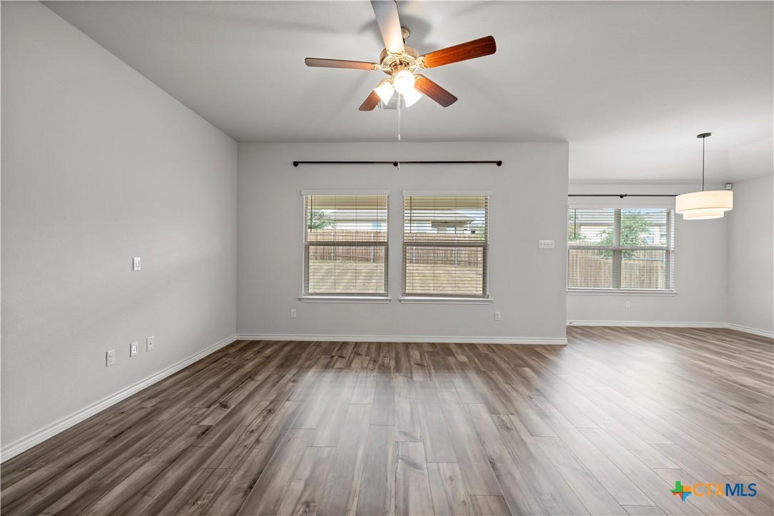 6243 Matagorda Road Belton, TX 76513 - Photo 13 of 27 wooden floor in an empty room with a window