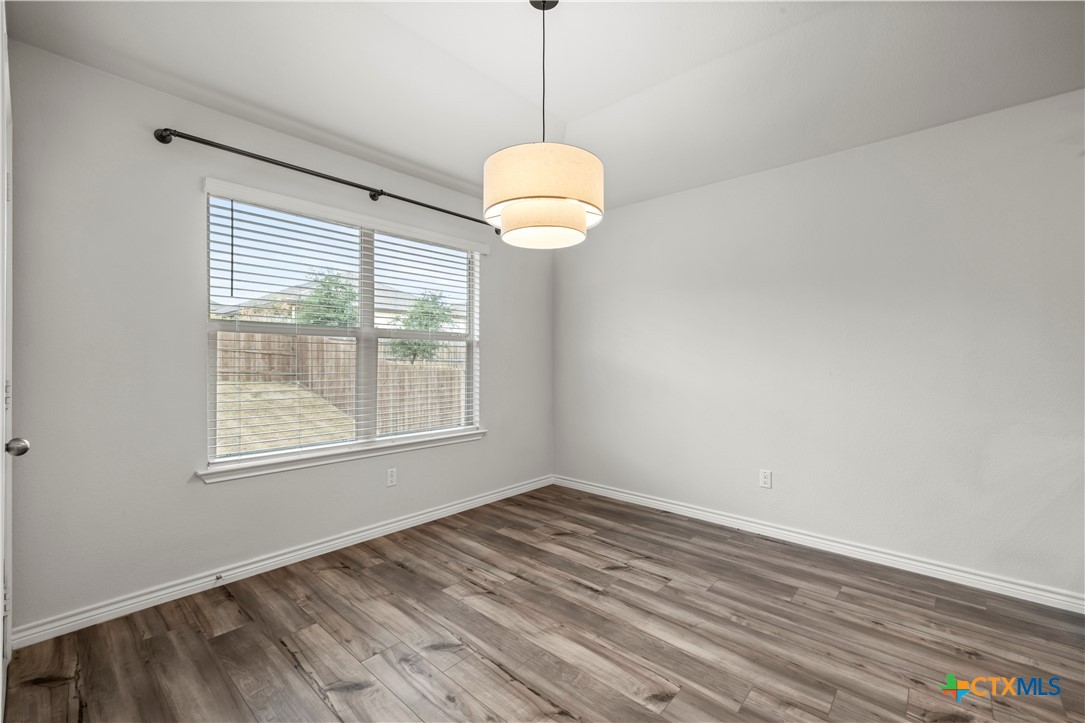 6243 Matagorda Road Belton, TX 76513 - Photo 14 of 27 a room with window and wooden floor