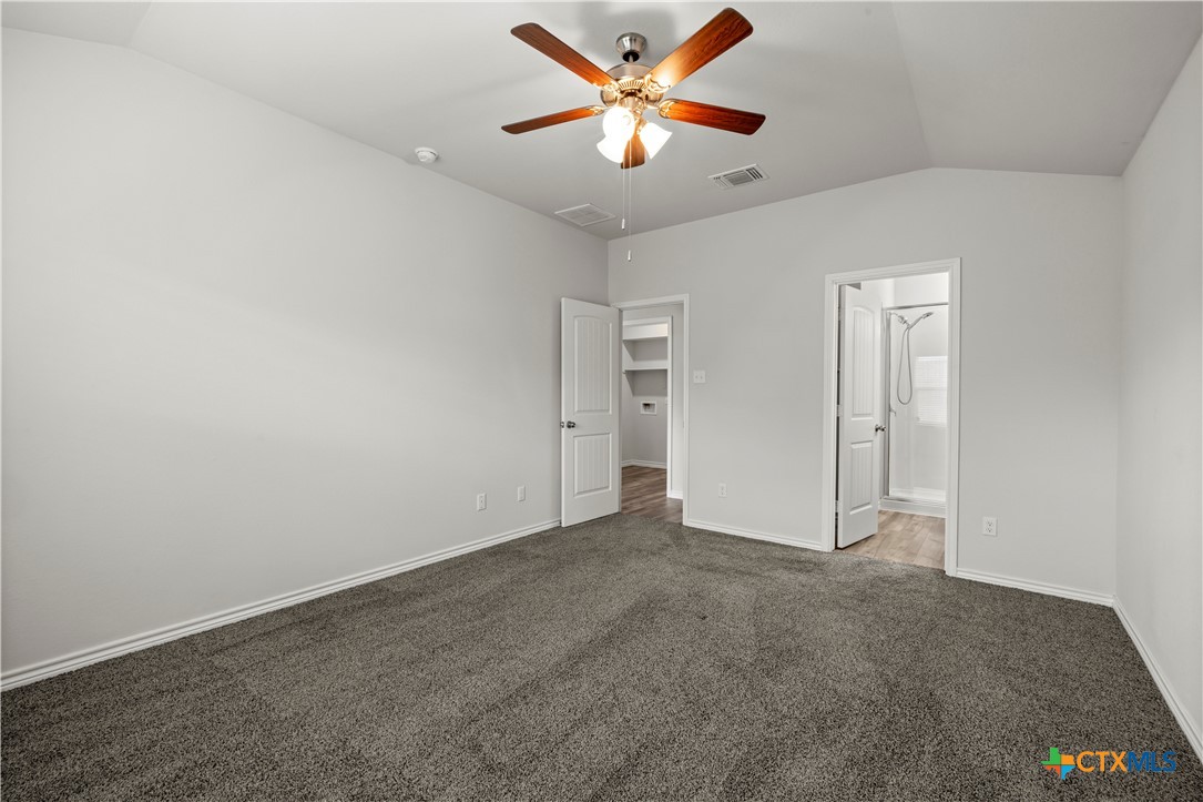 6243 Matagorda Road Belton, TX 76513 - Photo 18 of 27 an empty room with closet and a ceiling fan