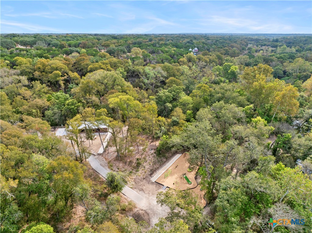 6243 Matagorda Road Belton, TX 76513 - Photo 26 of 27 an aerial view of residential house with outdoor space and trees all around