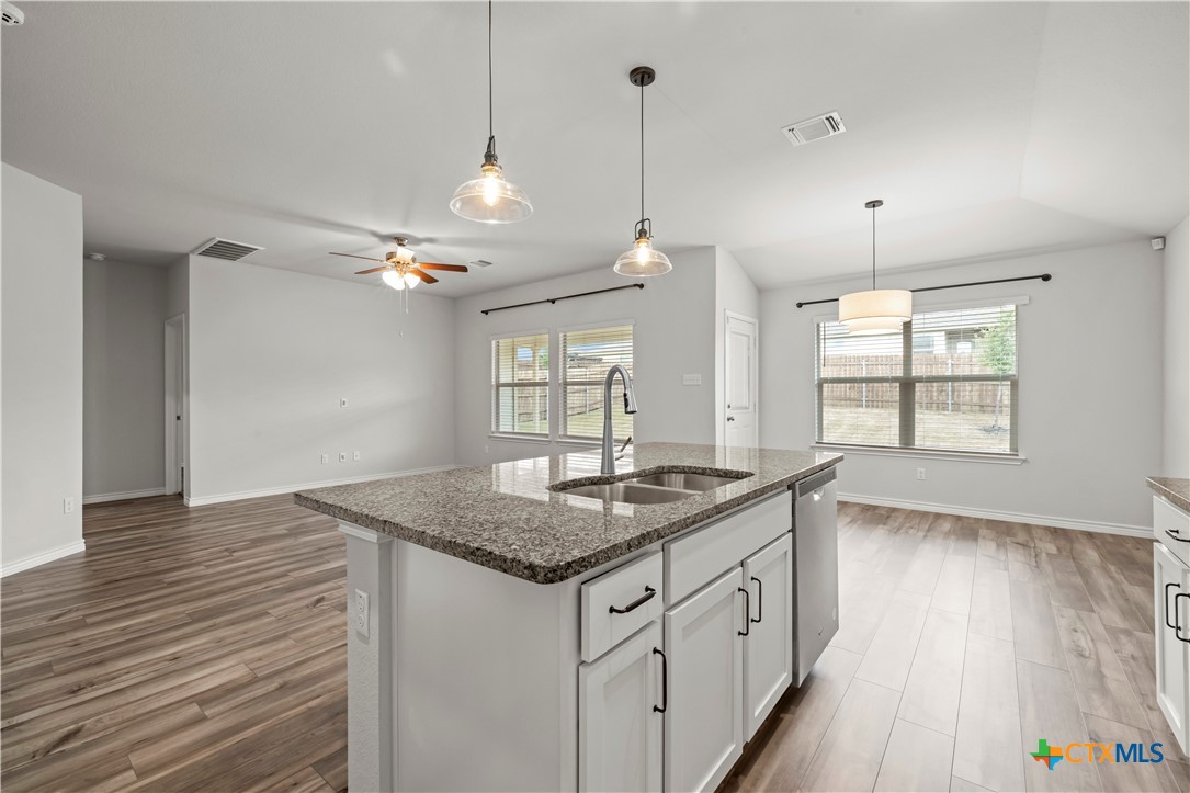6243 Matagorda Road Belton, TX 76513 - Photo 8 of 27 a kitchen that has a lot of counter space and a sink in it