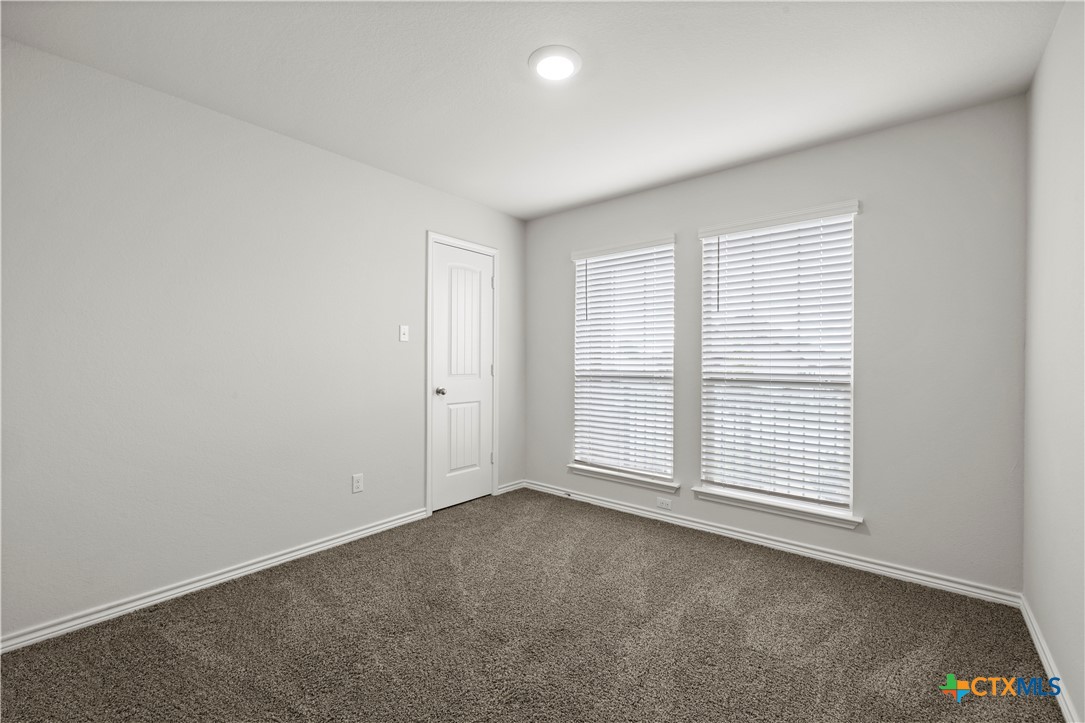 6243 Matagorda Road Belton, TX 76513 - Photo 9 of 27 an empty room with windows