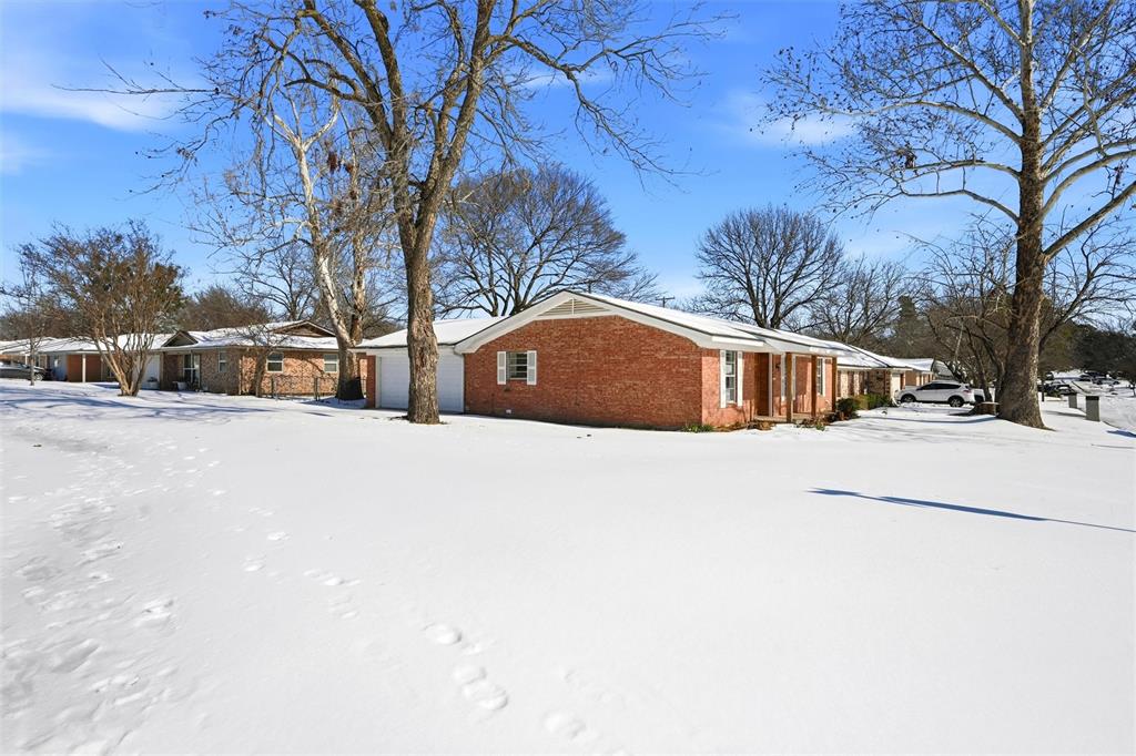 2611 Easy Street Denison, TX 75020 - Photo 2 of 32 a view of road with a house