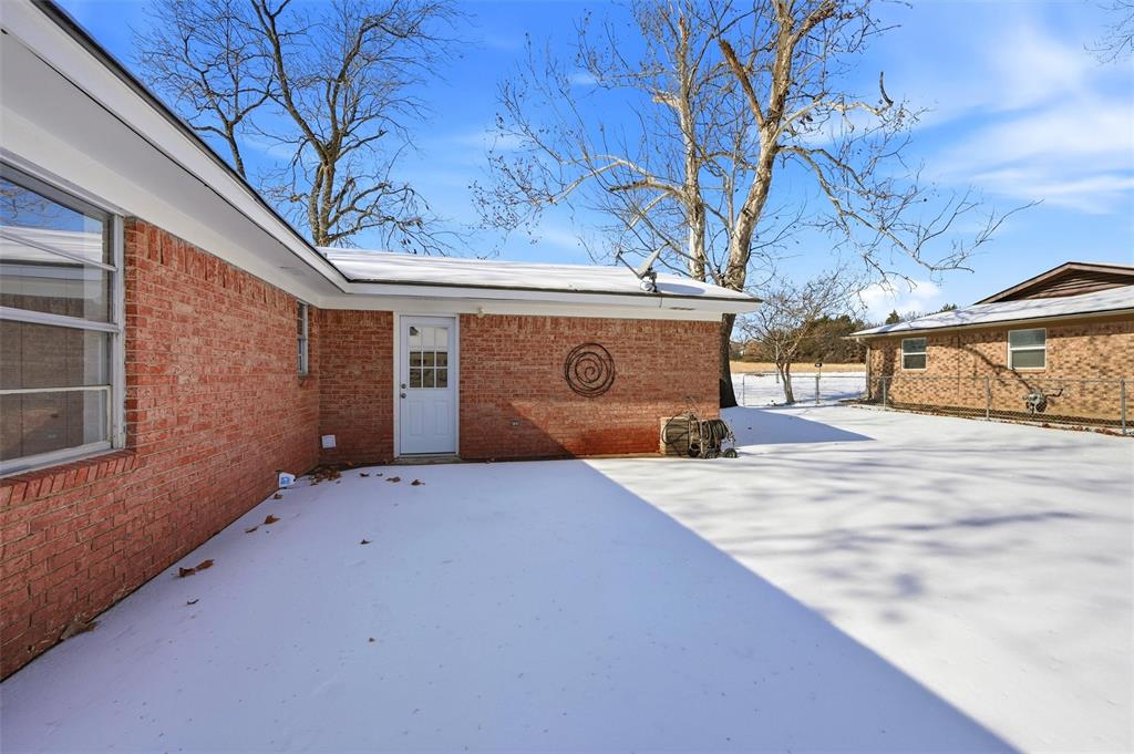 2611 Easy Street Denison, TX 75020 - Photo 27 of 32 a view of garage with a table and a chair