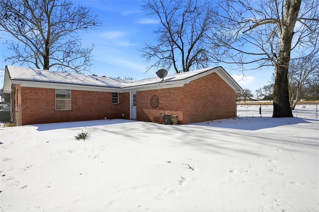 2611 Easy Street Denison, TX 75020 - Photo 28 of 32 a front view of a house with a yard