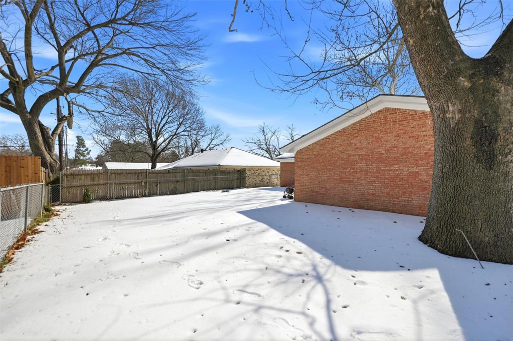 2611 Easy Street Denison, TX 75020 - Photo 29 of 32 a view of a backyard of a house