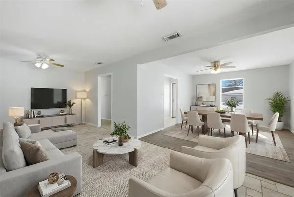 a living room with furniture and a flat screen tv