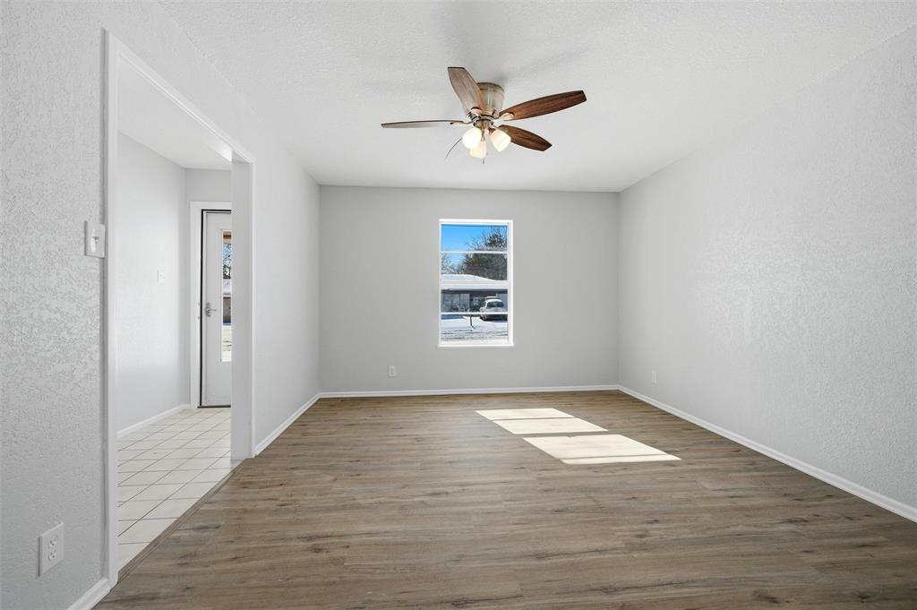 2611 Easy Street Denison, TX 75020 - Photo 7 of 32 wooden floor in an empty room