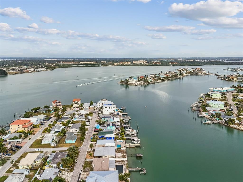 247 144th Avenue Madeira Beach, FL 33708 - Photo 17 of 29 a view of a lake with a city