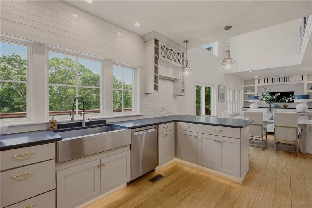 26 Old Stone Church Road Little Compton, RI 02837 - Photo 13 of 49 Kitchen with breakfast bar featuring sopastone counters