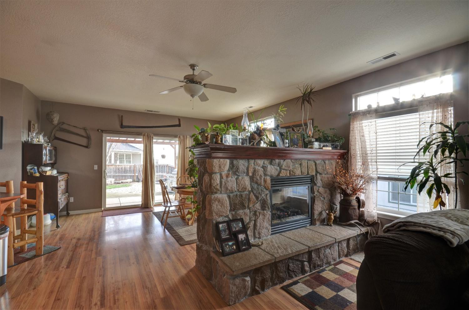 917 Ridgeview Drive Eagle Point, OR 97524 - Photo 6 of 31 a living room with furniture and a fireplace