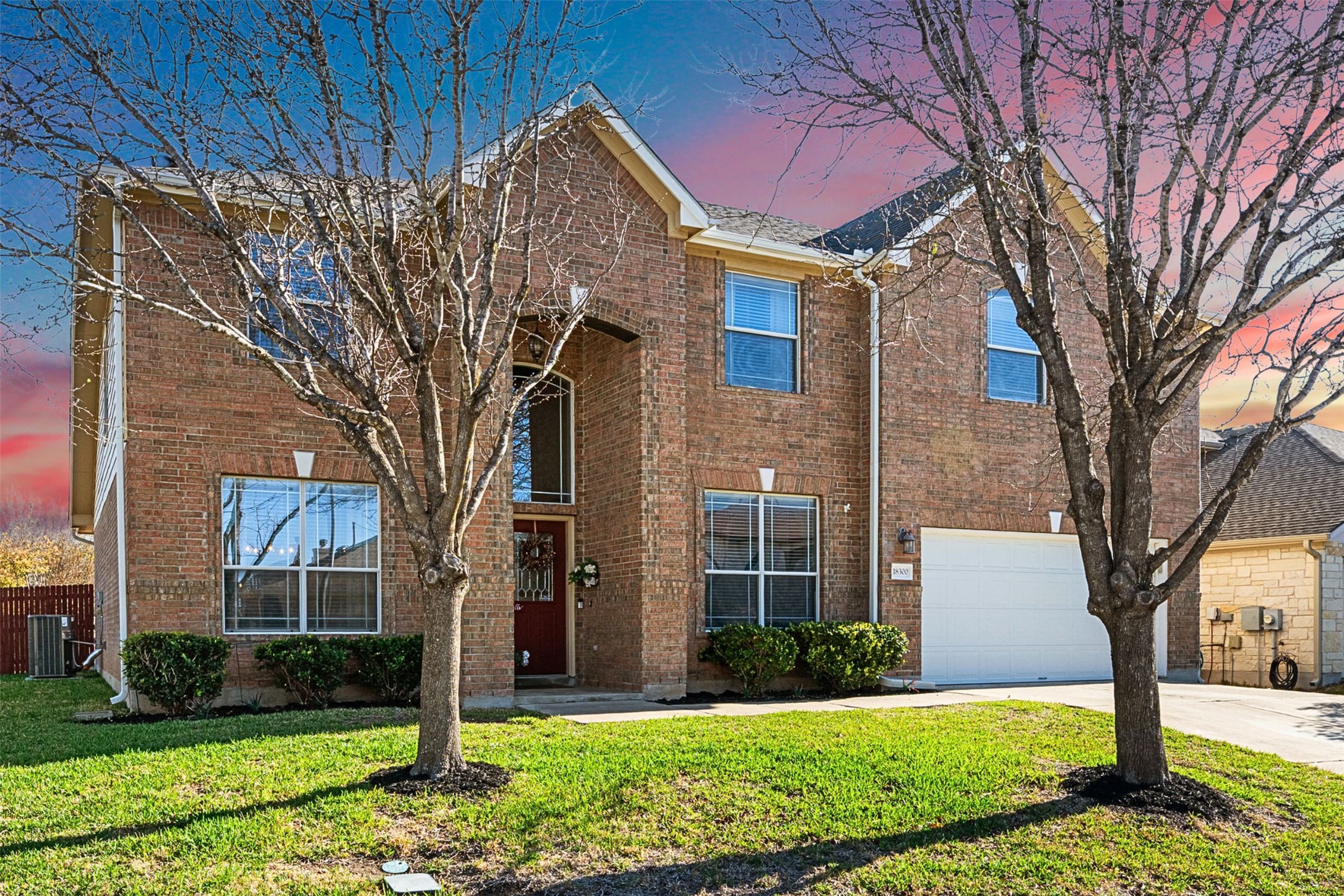 18300 Shallow Pool Drive Pflugerville, TX 78660 - Photo 1 of 40 a front view of a house with a yard and garage