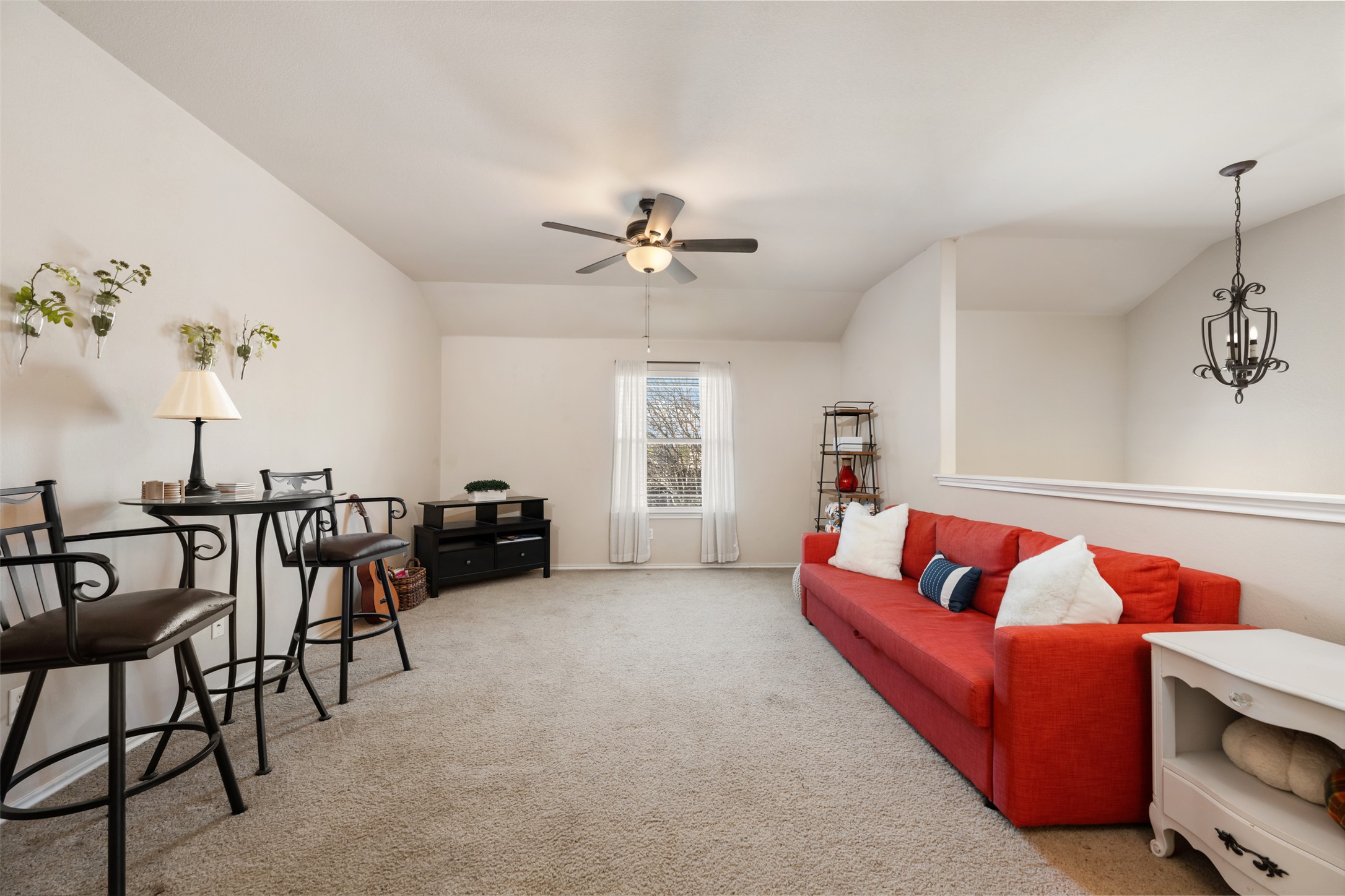 18300 Shallow Pool Drive Pflugerville, TX 78660 - Photo 6 of 40 a living room with furniture and a chandelier