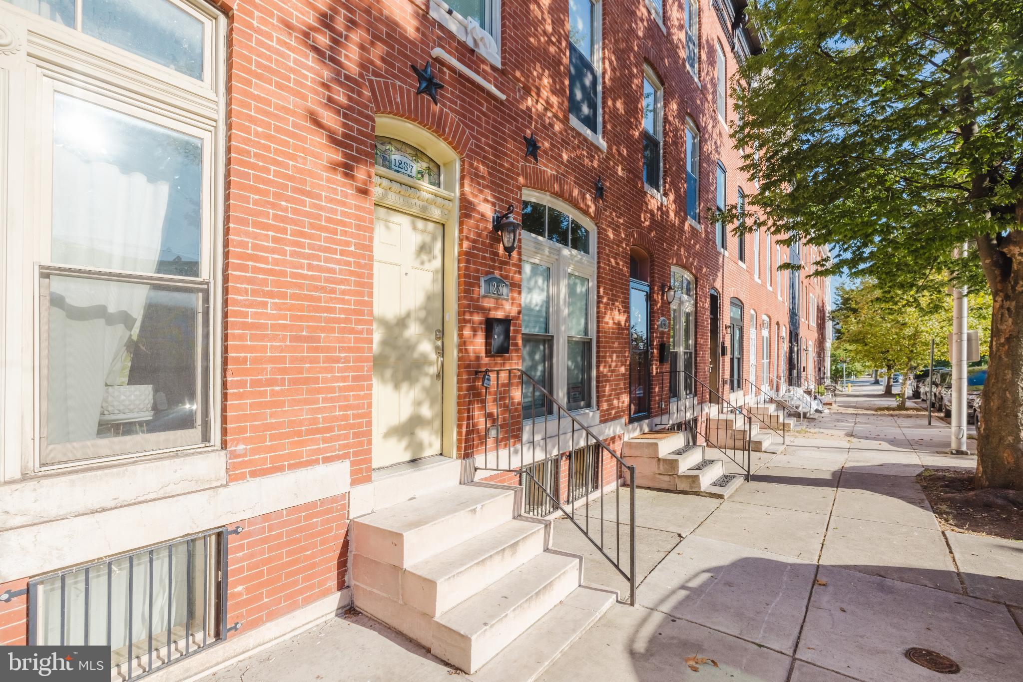 1237 North Broadway Baltimore, MD 21213 - Photo 1 of 25 3 Story Charming brick home line the sunny street.