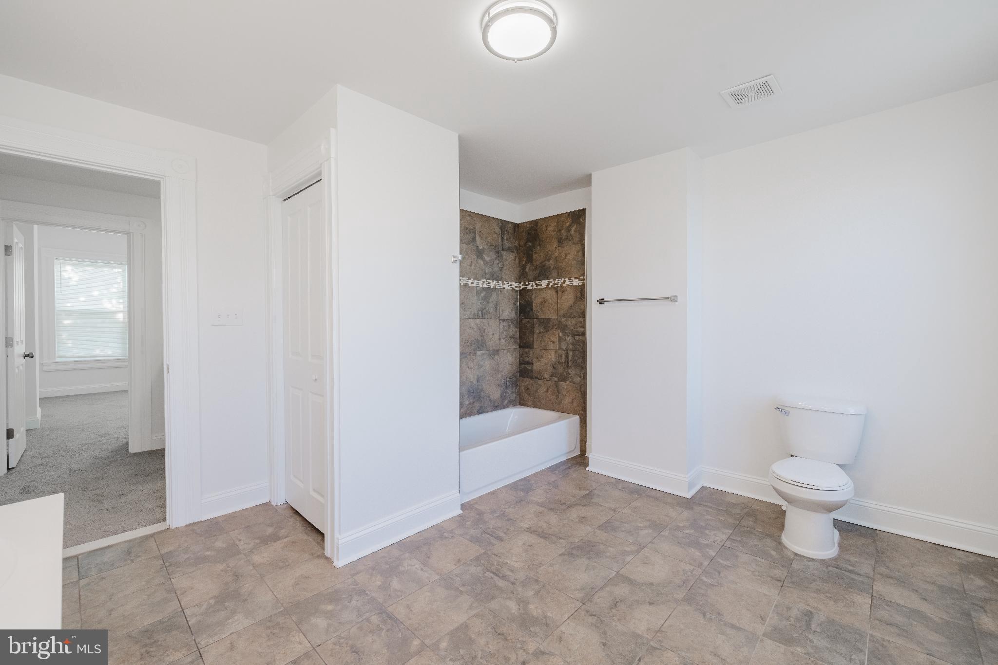 1237 North Broadway Baltimore, MD 21213 - Photo 18 of 25 Spacious, modern bathroom with elegant finishes.