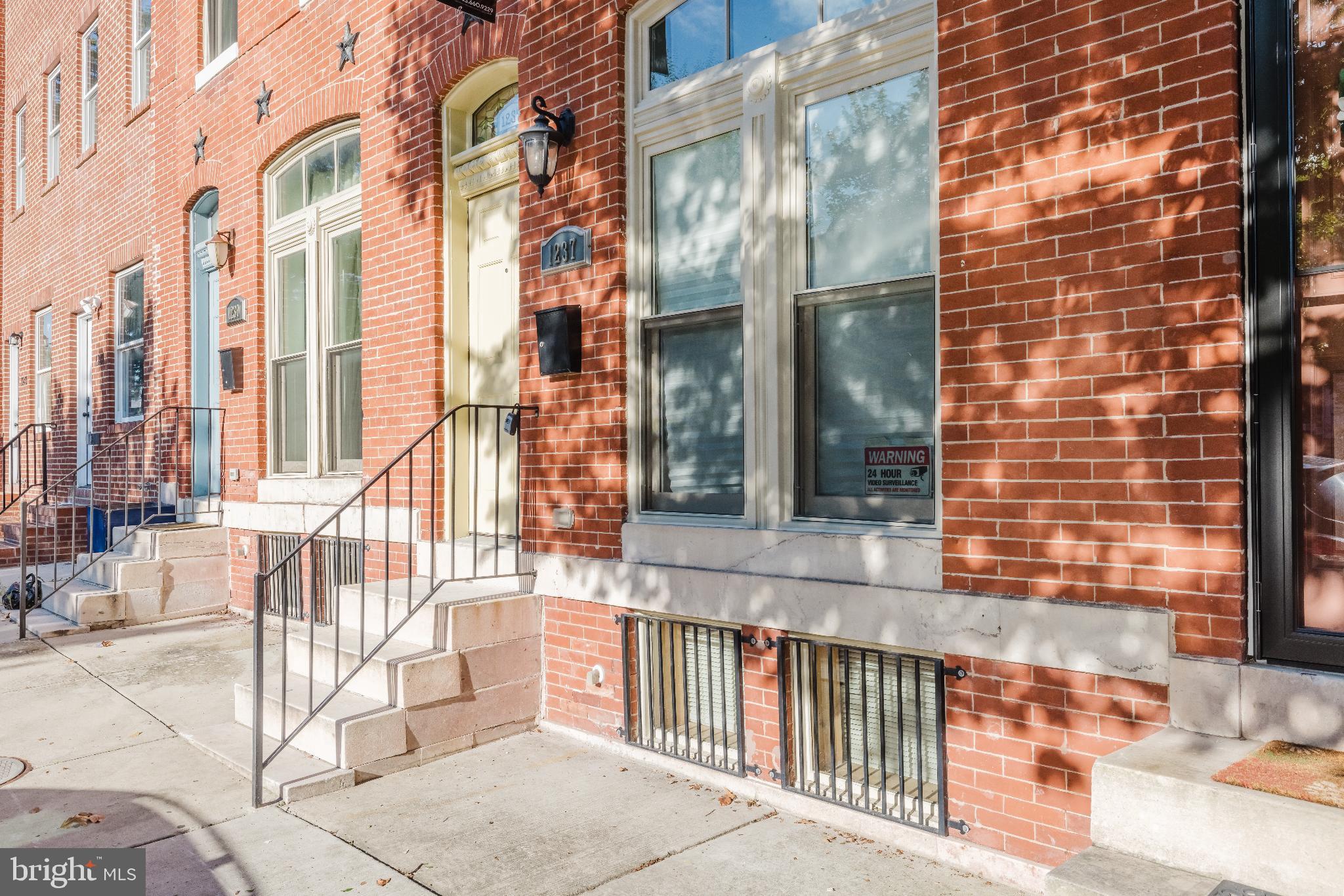 1237 North Broadway Baltimore, MD 21213 - Photo 22 of 25 3 Story Charming brick facade with inviting steps.
