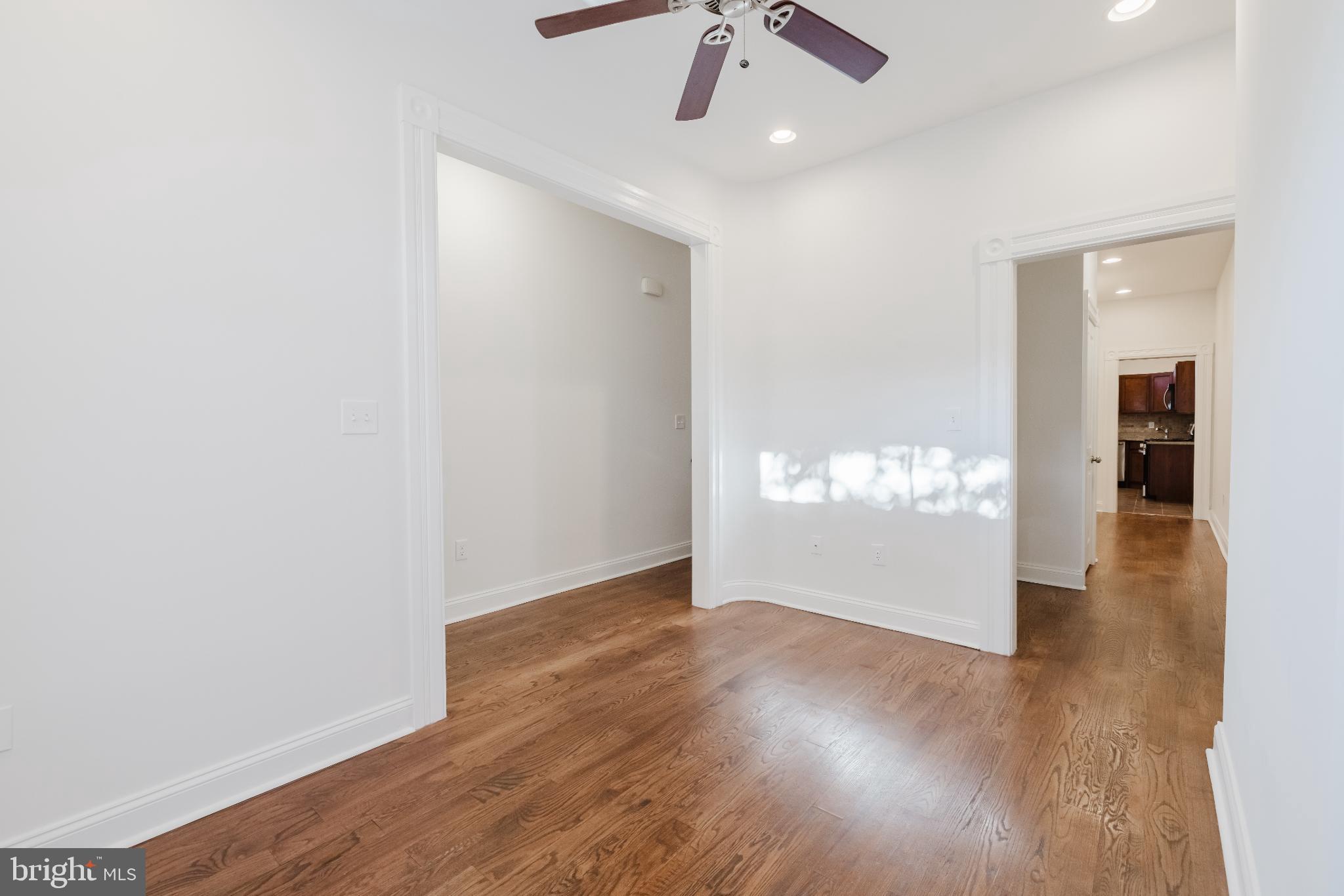 1237 North Broadway Baltimore, MD 21213 - Photo 3 of 25 Bright and airy entryway with hardwood floors.