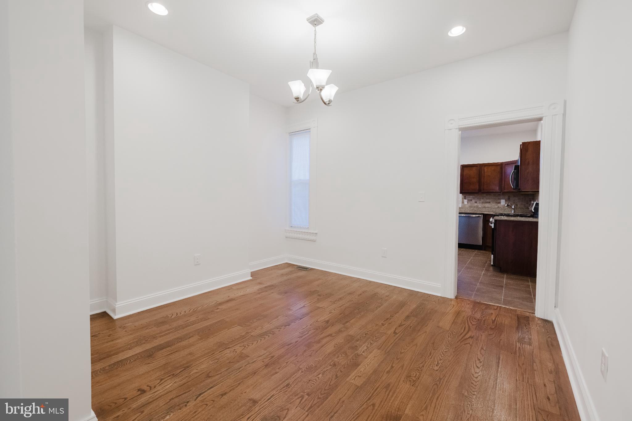 1237 North Broadway Baltimore, MD 21213 - Photo 5 of 25 Bright and airy space with hardwood floors.
