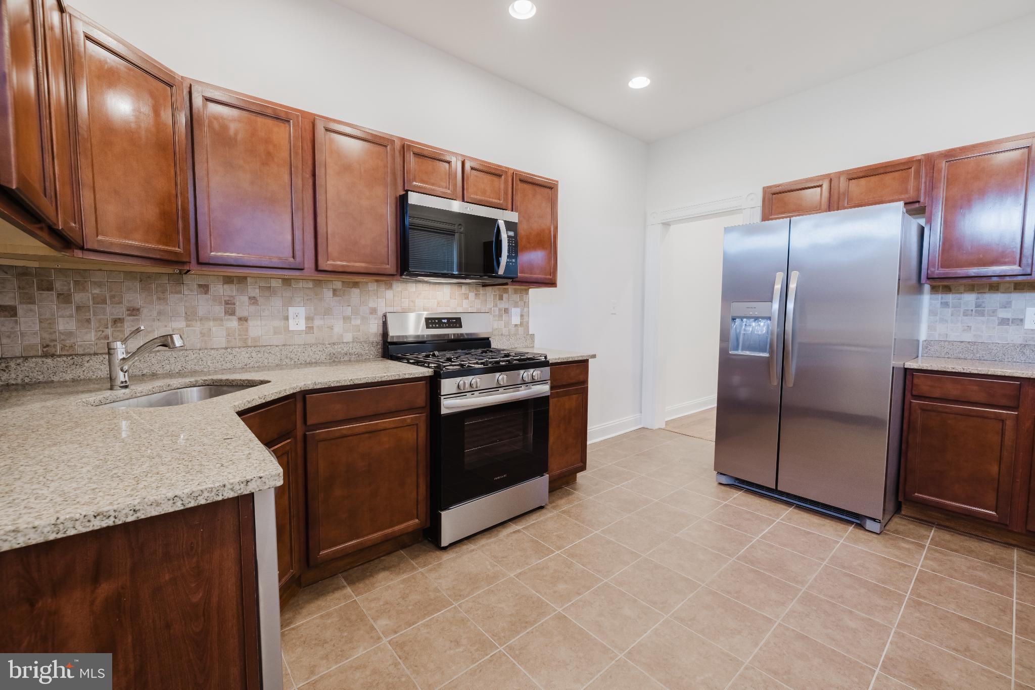 1237 North Broadway Baltimore, MD 21213 - Photo 6 of 25 Modern kitchen with sleek finishes.
