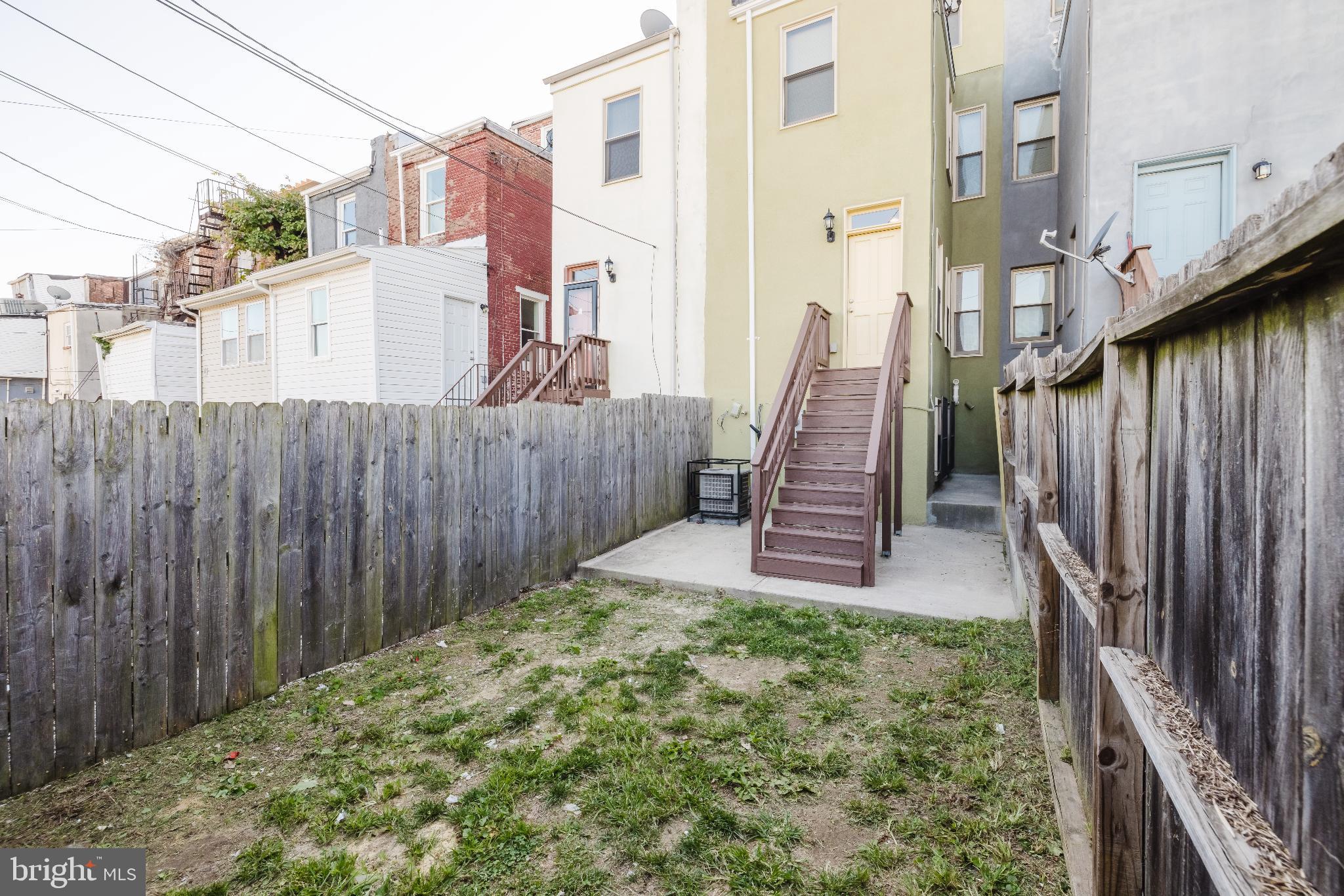 1237 North Broadway Baltimore, MD 21213 - Photo 8 of 25 Charming backyard with potential for creativity.