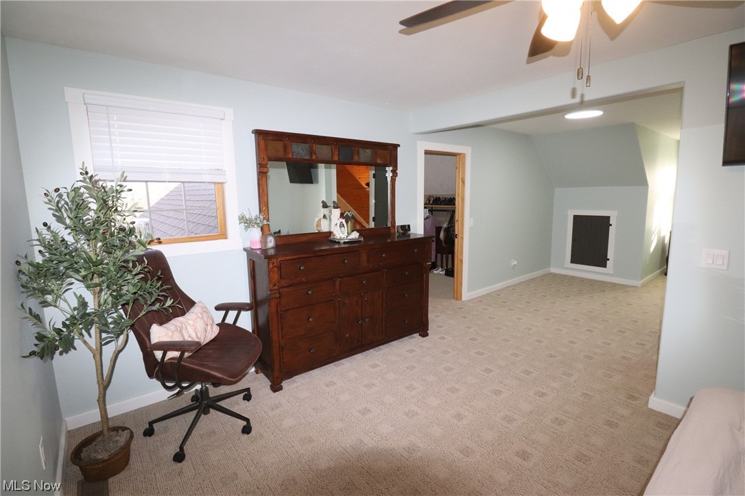 10582 Irvin Road Creston, OH 44217 - Photo 27 of 47 Sitting room with light colored carpet and ceiling fan