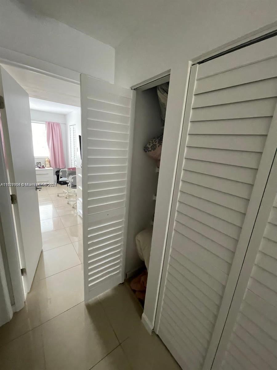15821 Southwest 104th Terrace, Unit 203 Miami, FL 33196 - Photo 18 of 25 a view of a walk in closet