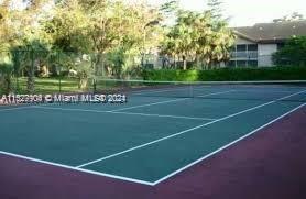 15821 Southwest 104th Terrace, Unit 203 Miami, FL 33196 - Photo 23 of 25 a view of a tennis court