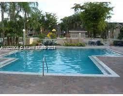 15821 Southwest 104th Terrace, Unit 203 Miami, FL 33196 - Photo 24 of 25 a view of a house with backyard