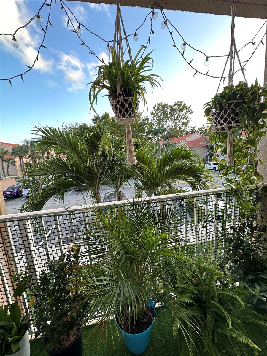 15821 Southwest 104th Terrace, Unit 203 Miami, FL 33196 - Photo 4 of 25 a view of a balcony with lake view