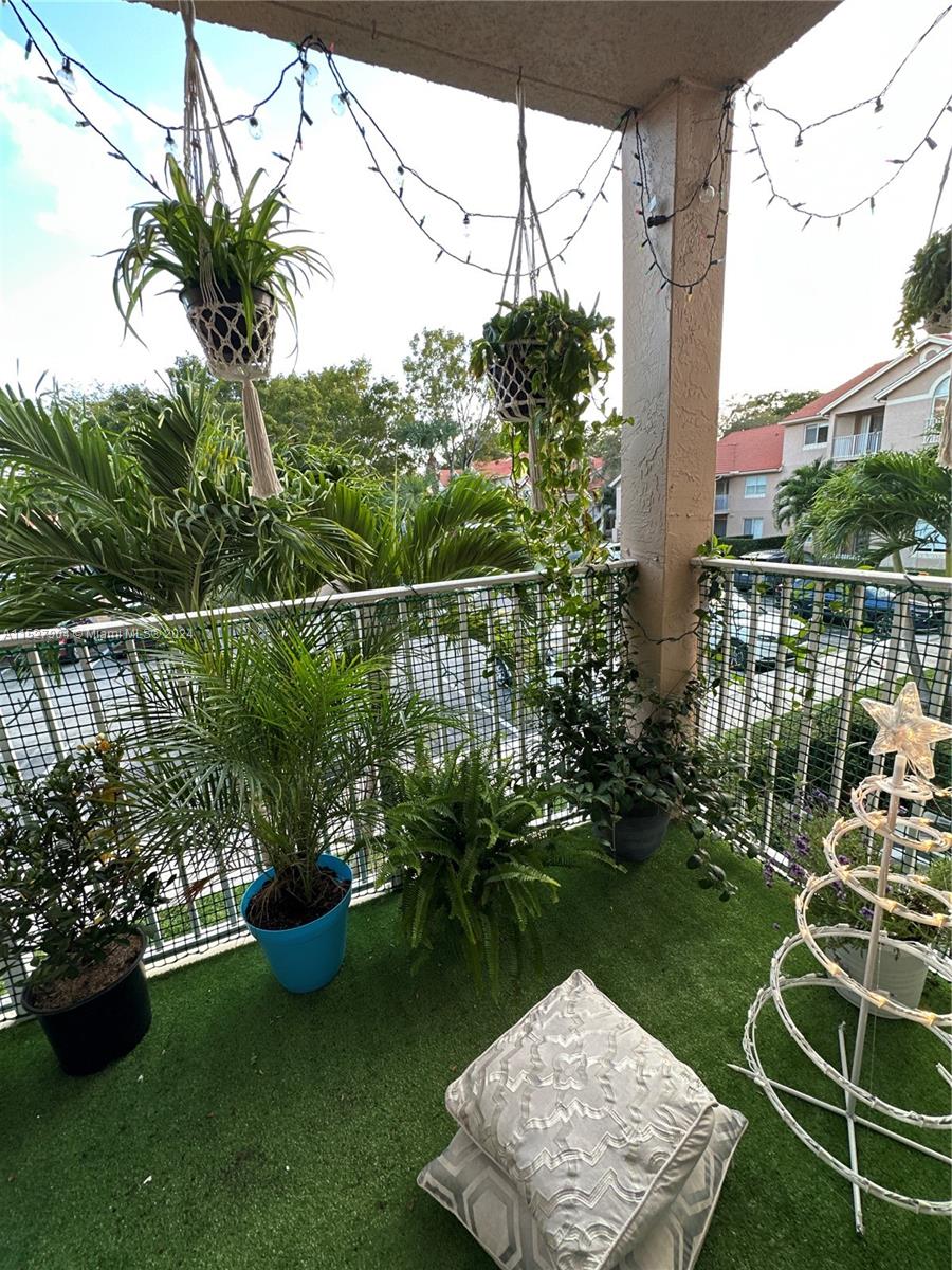 15821 Southwest 104th Terrace, Unit 203 Miami, FL 33196 - Photo 5 of 25 a view of a garden with a lake view