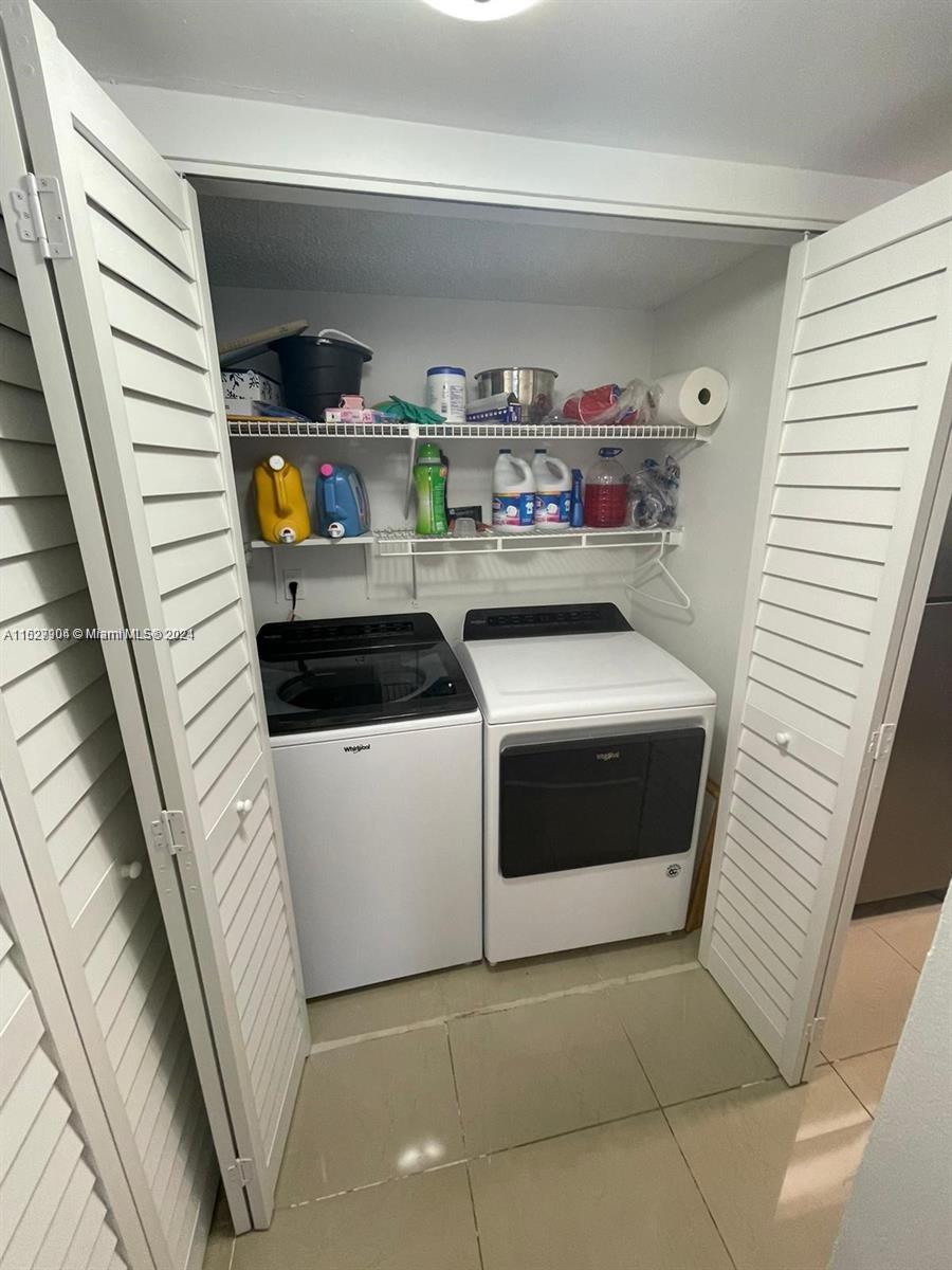 15821 Southwest 104th Terrace, Unit 203 Miami, FL 33196 - Photo 7 of 25 a utility room with dryer and washer