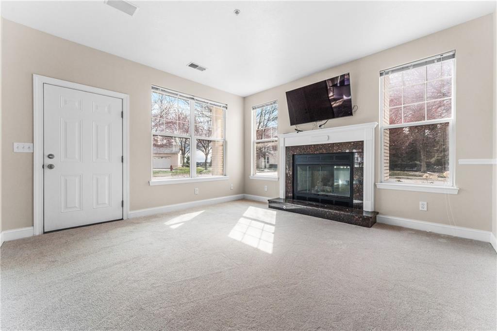 216 Adams Pointe Boulevard, Unit 10 Mars, PA 16046 - Photo 15 of 33 a view of empty room with a fireplace