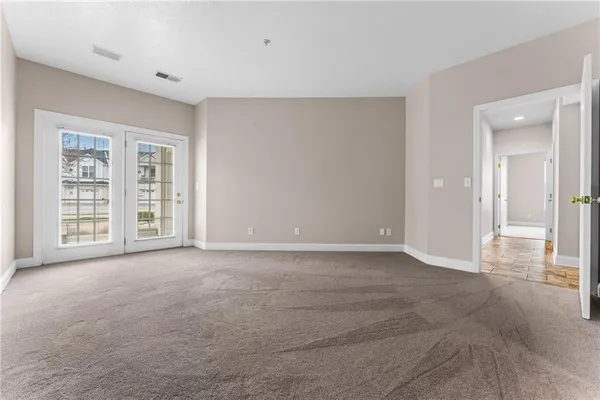 a view of an empty room with a window