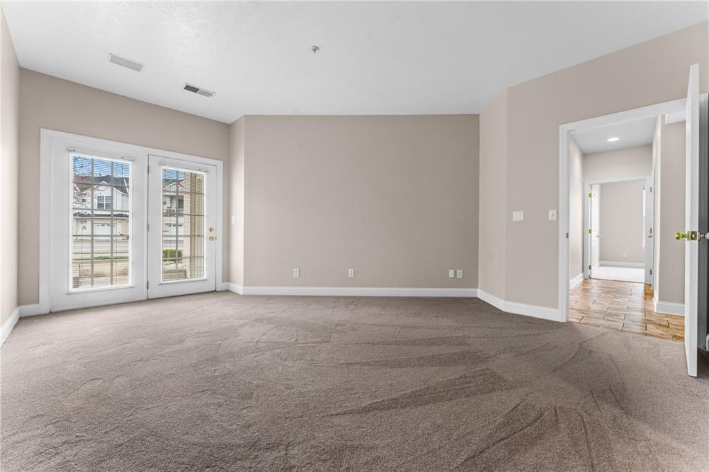 216 Adams Pointe Boulevard, Unit 10 Mars, PA 16046 - Photo 18 of 33 a view of an empty room with a window