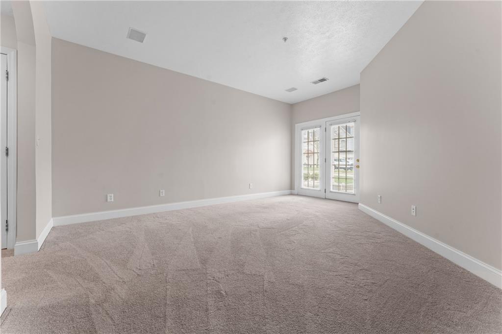 216 Adams Pointe Boulevard, Unit 10 Mars, PA 16046 - Photo 19 of 33 a view of an empty room with a window