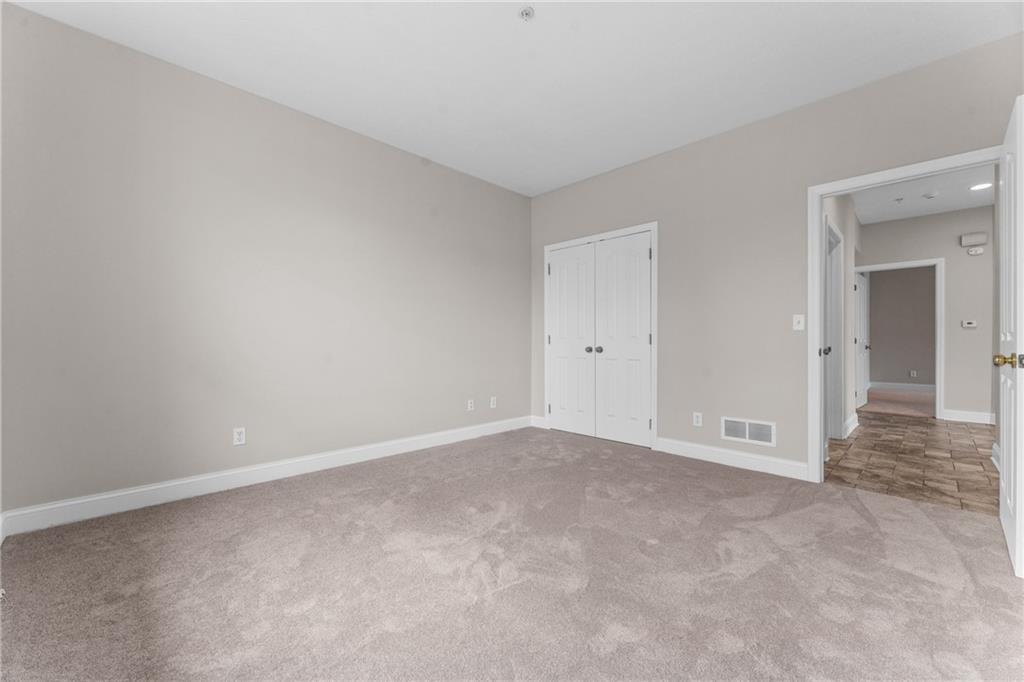216 Adams Pointe Boulevard, Unit 10 Mars, PA 16046 - Photo 23 of 33 a view of an empty room and closet area