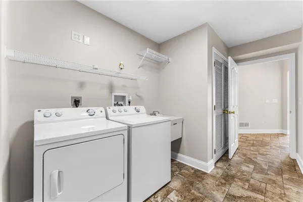 a utility room with dryer and washer