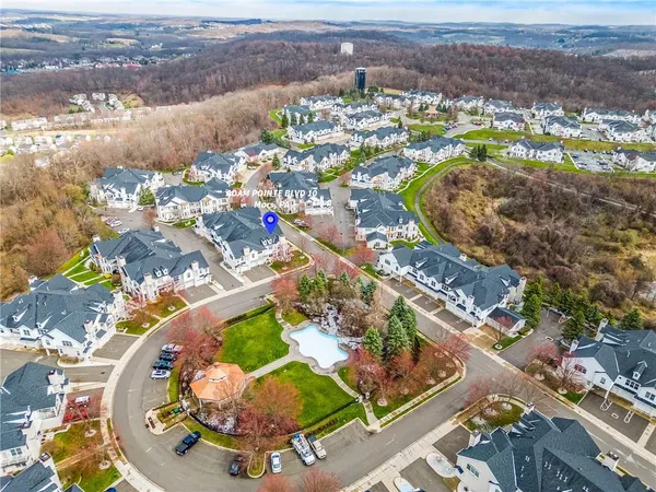 an aerial view of residential houses with outdoor space